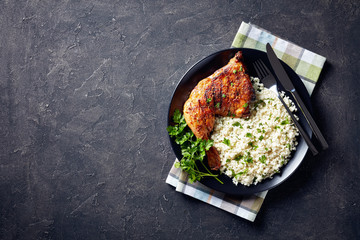 Wall Mural - broiled chicken leg quarter with Cauliflower rice