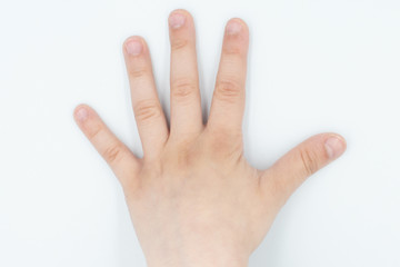 This is a capture for a child hand on a white background in a studio light 