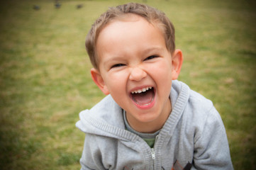 Portrait of a little mischievous boy