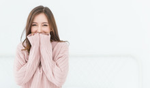 Portrait Of Young Beautiful Asian Woman Relax In Her Bedroom. Smile Happy Face Asian Girl Wear Winter Cloth. Beauty Treatment Perfect Clear Skin Japanese Makeup  Lifestyle Concept Banner Background