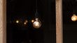 © lashkhidzetim - A classic Edison light bulb on black background with space for text