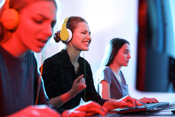 Wall Mural - Young people playing video games on computers indoors. Esports tournament