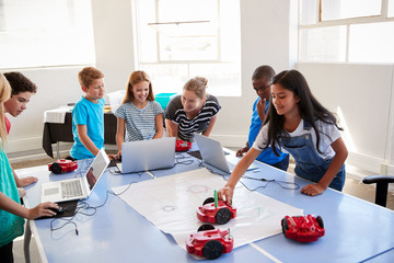 Wall Mural - Group Of Students In After School Computer Coding Class Learning To Program Robot Vehicle