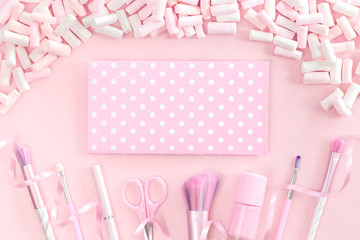 Wall Mural - Feminine nail polish accessories and unicorn makeup brushes on pink background with trendy pastel marshmallows. Flat lay with copy space, beauty and cosmetics blogger concept