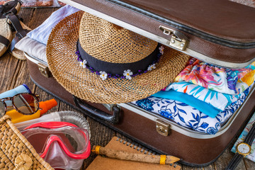 Suitcase preparation for a summer holiday , Retro , vintage and old luggage   