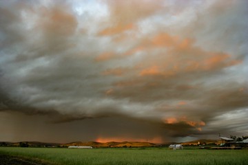 Wall Mural - colorful storm over the countryside in romania at sunset
