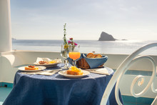 Typical Sicilian Breakfast With Homemade Jams And Fresh Orange Juice And View From The Island Of Panarea