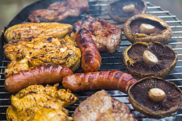 Assorted delicious grilled meat over the coals.