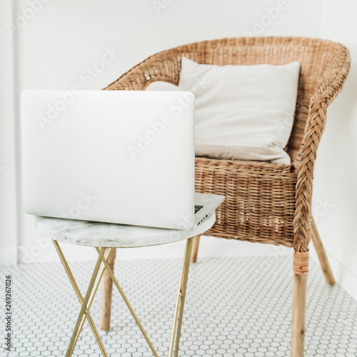 Work At Home Concept With Laptop Rattan Chair With Pillow