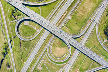 Big road junction on green land aerial view