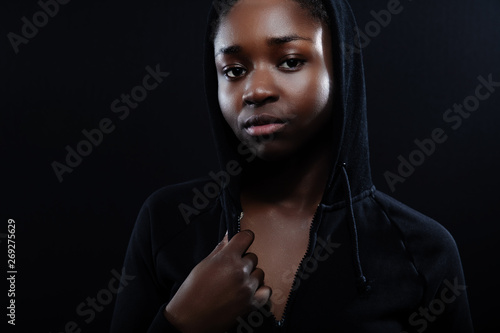 Natural Woman With Dark Skin And Attitude Wearing Black Hoodie