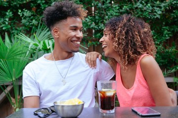 young lovers celebrating their anniversary at a restaurant. cheerful loving couple having fun at a s