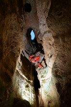 Spelunker In Cija De Los Royos Cave,Teruel Province, Aragon, Spain.