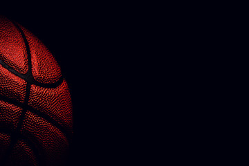 Wall Mural - basketball ball on black background.