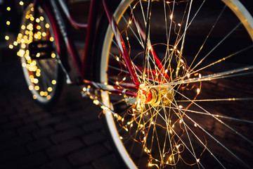 Christmas lights on bike background texture in city