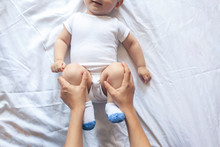 Baby Massage. Mom Doing Gymnastics With Kid. Mommy Massaging Cute Baby Boy. Moving Baby's Legs To Help Relieve Constipation. Young Mother Doing Exercises And Movements To Stimulate Baby's Bowels.