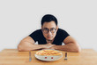 © Sevendeman - Serious face of man is eating homemade breakfast set of omelet.
