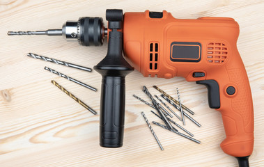 Cordless screwdriver with a drill