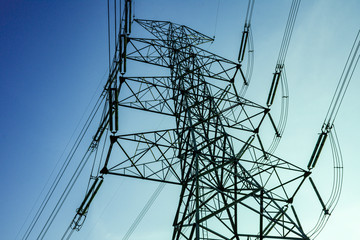 Electricity pole against blue sky clouds in dawn time, Transmission line of electricity to rural, electricity transmission pylon