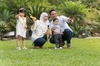 © faizzaki - Malay family at recreational park having fun