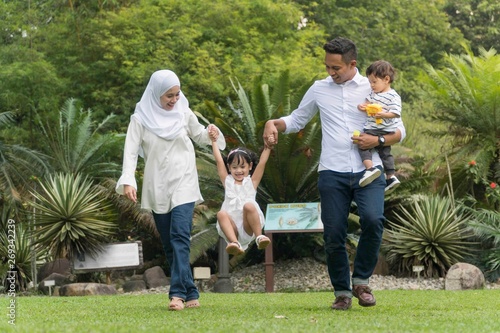 Cuadros en Lienzo Malay family at recreational park having fun