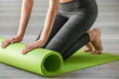 © Pixel-Shot - Young sporty woman with yoga mat in gym
