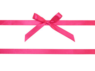 Wall Mural - Two pink satin ribbon horizontally with bow on white background