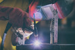 © Monika Wisniewska - Welding steel elements at the factory or workshop