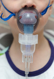 Fototapeta  - baby breathes through masks for inhalers