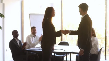 Wall Mural - happy manager handshake promote praise female employee for good work
