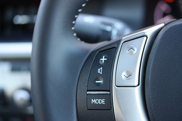 Volume, skip and mode buttons on steering wheel