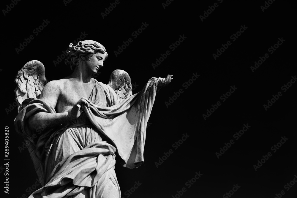 Angel statue holding the Holy Veil.  A 17th century baroque masterpiece at the top of Sant'Angelo Bridge in the center of Rome (Black and White with copy space) - obrazy, fototapety, plakaty 