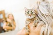 © Marek - Woman playing with home cat - lovely pet