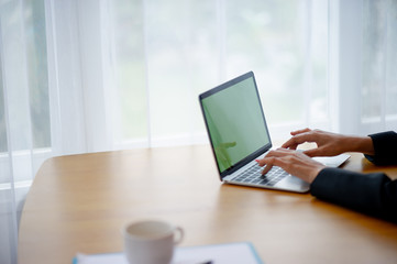 Computer hands of businessmen are working. In the business concept