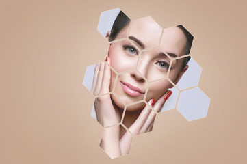 Portrait of model with natural nude make up touching her face in beige hexagon frames. Beautiful happy young woman applying moisturizer cream on her perfect glow clean skin.