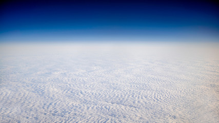 Wall Mural - Wonderful view of cloudscape with clear blue sky from above.
