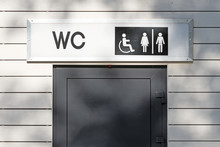 Public Toilet Entrance Front Close Up View Of Restroom Door With Wc Sign For Men Women Accessible Disabled Person In City Street Outdoor Bathroom Authentic Lifestyle Concept Natural Color Photo