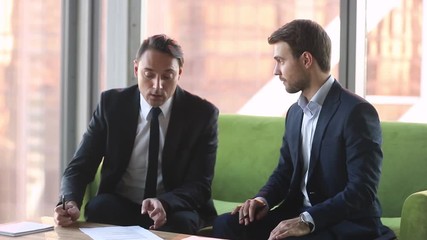 Poster - Two businessmen in suits making deal agreement handshake signing contracts