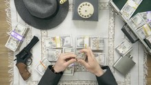 Old Time Gangster Counting Stacks Of Money. 50's 60's 70's Vintage Scene. Historical Reenactment Concept.