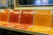 Colorful seats in a New York City subway car