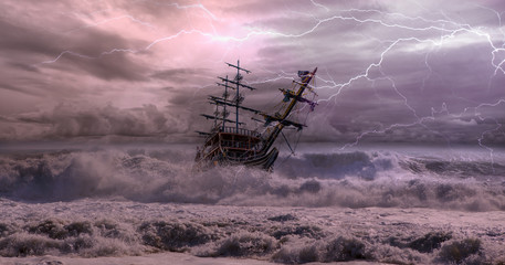 sailing old ship in storm sea against dramatic sunset