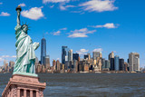 Fototapeta Nowy Jork - The Statue of Liberty over the Scene of New york cityscape river side which location is lower manhattan,Architecture and building with tourist concept