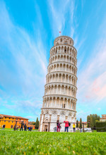 The Leaning Tower And Pisa Cathedral At Bright Blue Sky - Pisa, Italy