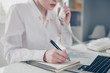 © deagreez - Cropped close up photo beautiful she her business lady pen pencil make notes notepad organizer listen important talk boss chief instruction notebook table bright office wear formal-wear white shirt