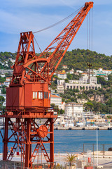 Vintage red port crane. French Riviera, Nice