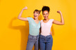 © deagreez - Portrait cute hipsters youth millennial raise fist scream yes yeah ready save world bodybuilders sport strong wavy curly hairdo style stylish trendy jeans t-shirts top-knot isolated yellow background