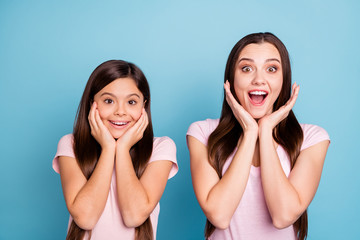 Canvas Print - Close-up portrait of two nice-looking cute charming attractive lovely amazing cheerful cheery straight-haired girls showing excitement isolated over bright vivid shine green blue turquoise background