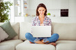 © deagreez - Close up photo beautiful she her lady short hairdo bob notebook knees barefoot tell speak skype friends wear checkered plaid shirt jeans denim sit comfort divan house loft living room indoors