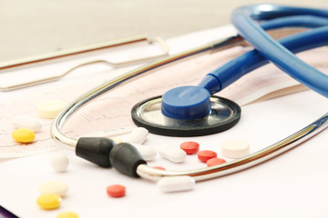 A stethoscope and a clipboard for notes as a medical check concept	