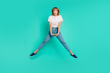 Canvas Print - Full length body size photo beautiful she her lady carefree childish weekend vacation jump high arms hands together achievement wear casual jeans denim white t-shirt isolated teal background